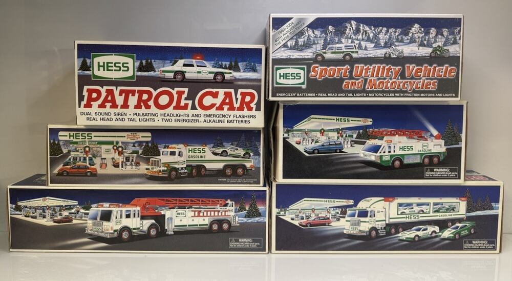 Brand New Hess Toy Trucks Lot 6 NIB - Patrol Car, SUV, Fire Trucks, Carrier